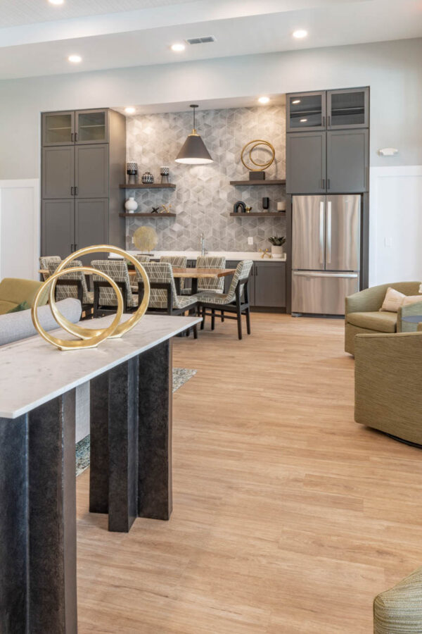 The Avery apartments lounge with plush seating and community kitchen.