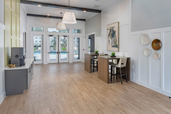 The Avery apartments lobby with coffee bar and tables with stools.
