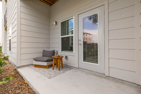 The Avery apartment balcony with outdoor chair.