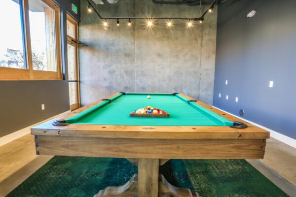 The Economist apartments game room with pool table.