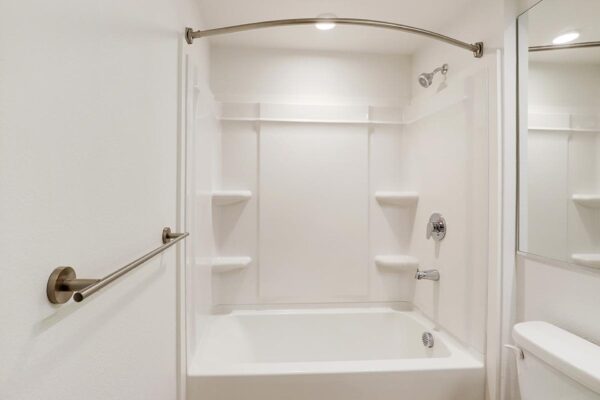 The Economist apartment bathroom with shower tub.