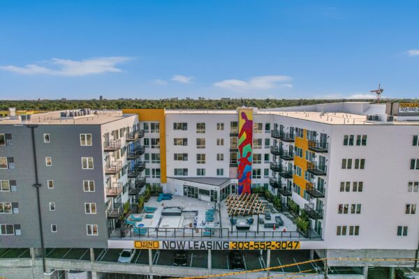 The Overland apartments with exciting pool deck and colorful mural.