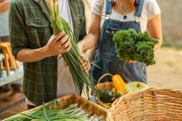Friends shopping together at farmer's market.