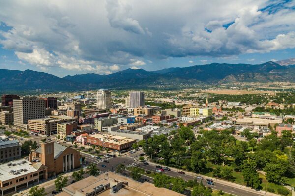 Aerial view of downtown Colorado Springs and the Rocky Mountains.