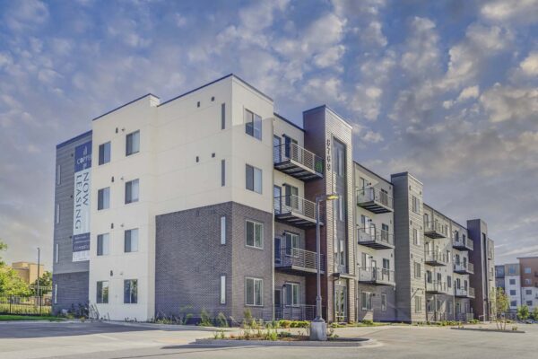 Copper 87 apartments with ample parking and lush landscaping.