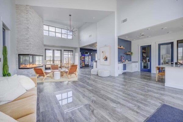 Copper 87 apartments clubhouse with wood furniture, fireplace, and vaulted ceilings.