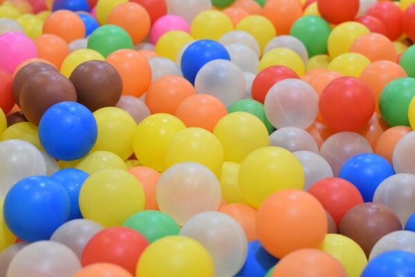 Colorful plastic balls in a ball pit.