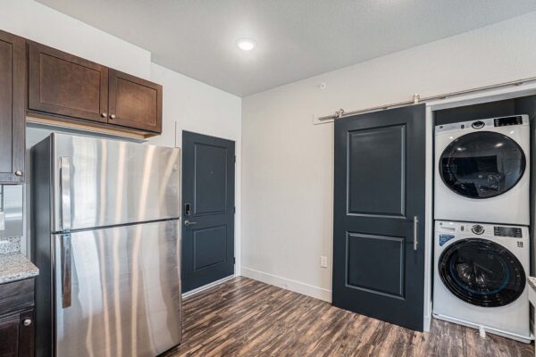 The Marc at Monument Ridge apartment kitchen with laundry closet.