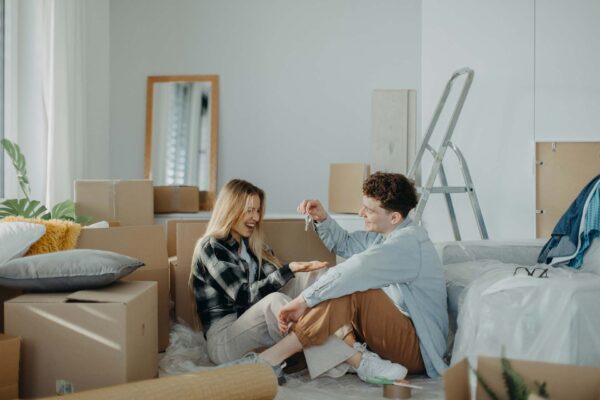 Couple unpacking in their new home.