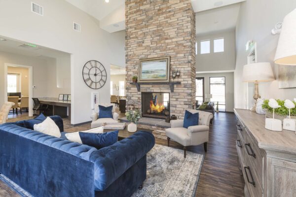The Retreat at Patriot Park clubhouse with plush seating, fireplace, and elegant decor.