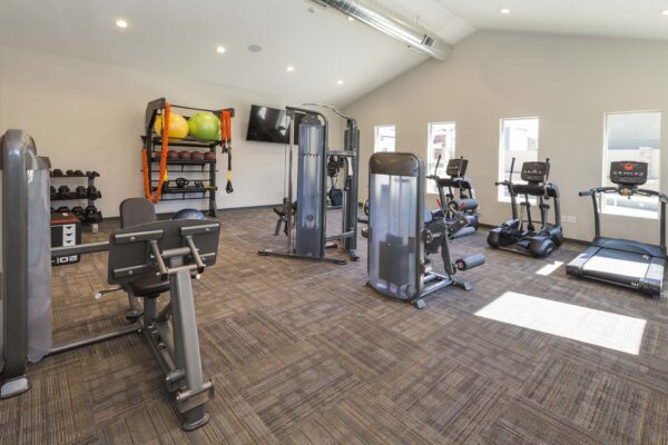 The Retreat at Patriot Park fitness center with cardio machines and weight equipment.