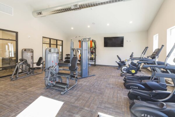 The Retreat at Patriot Park fitness center with cardio machines and weight equipment.