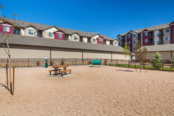 The Retreat at Patriot Park dog park with benches and play area.