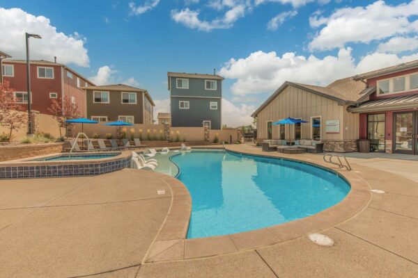 The Retreat at Patriot Park pool area with lounge seating and hot tub.