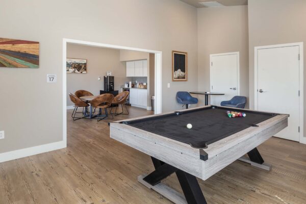 Cottages at Woodmen Heights apartment clubroom with billiards table.