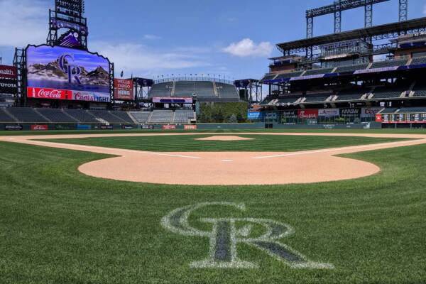 Field-level view of Coors Field baseball stadium in Denver.