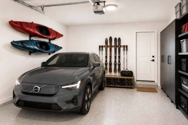 Rendering of the Row at Riverbed townhome garage with parked car and kayaks and skis hanging on the wall.